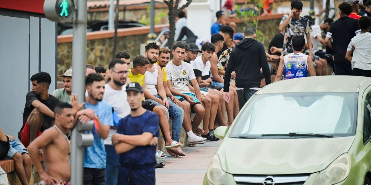 People smugglers traffic migrants OUT of Britain and into Spain