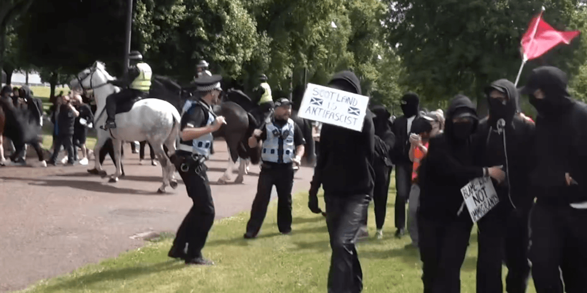 Anti-migrant and anti-racism protesters clash in Glasgow as police make 15 arrests