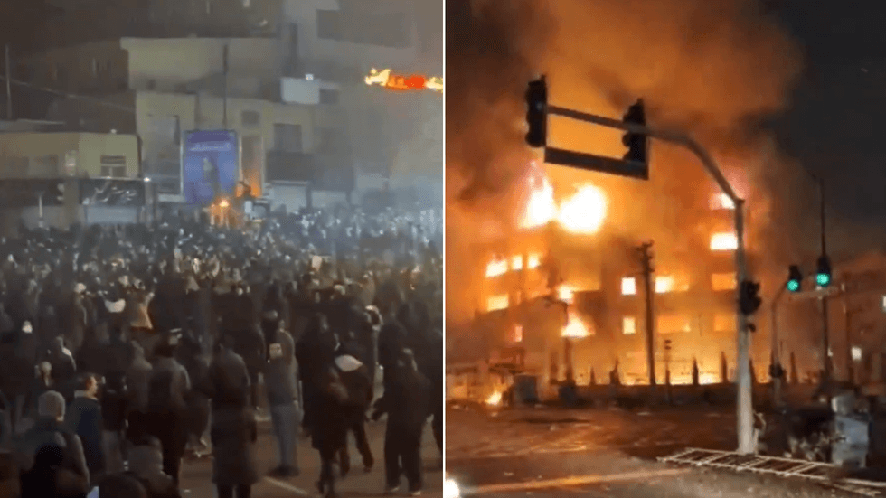 Iranian protesters on the march - and a local government municipality building burns