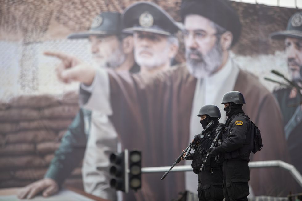Iranian regime soldiers and mural