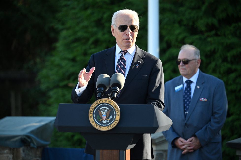 Joe Biden delivering a speech as US President at a podium