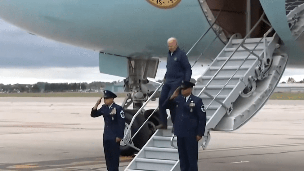 Joe Biden walks down the Air Force One steps