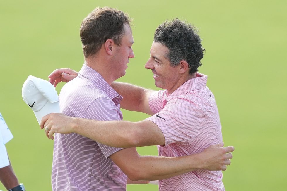 Justin Thomas and Rory McIlroy shared a hug after their gruelling round
