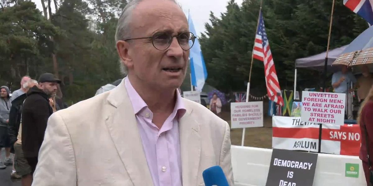 'Totally unacceptable!' Council leader joins furious locals in protest against 1,250 migrants being moved into RAF Barnham