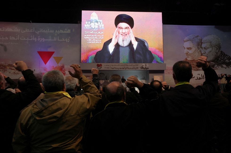 Lebanon's Hezbollah leader Sayyed Hassan Nasrallah addresses his supporters through a screen during a ceremony to mark the fourth anniversary of the killing of senior Iranian military commander General Qassem Soleimani