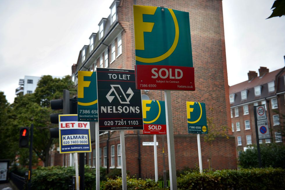 Letting and estate agents signs outside flats on the Old Kent Road in London
