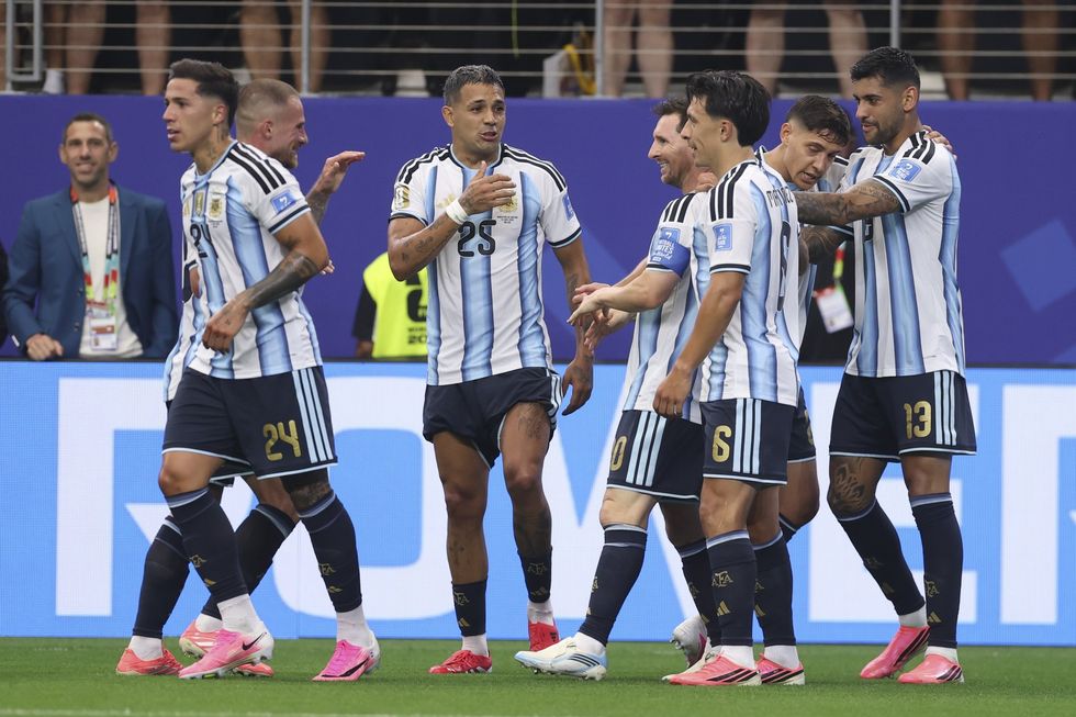 Lionel Messi celebrates with his teammates after breaking the deadlock in Argentina's World Cup match with Austria