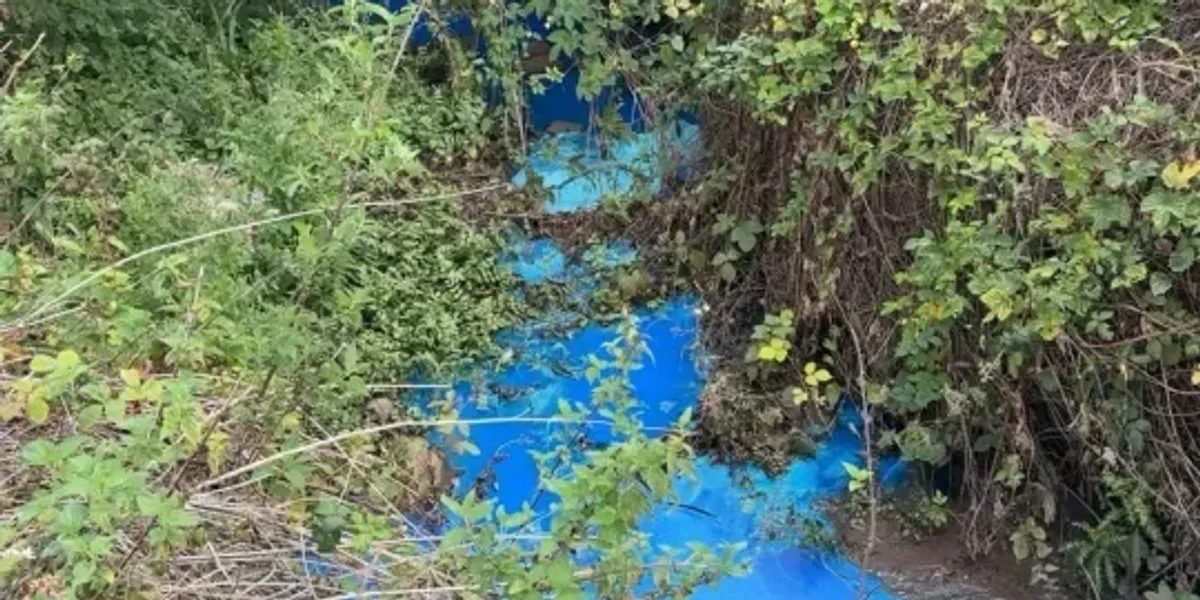 Mystery pollution turns water bright blue at popular beauty spot as Britons warned 'do not swim'