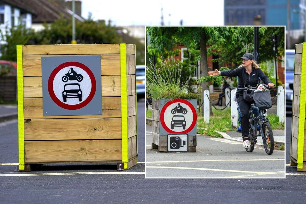 Low Traffic Neighbourhood sign and a cyclist