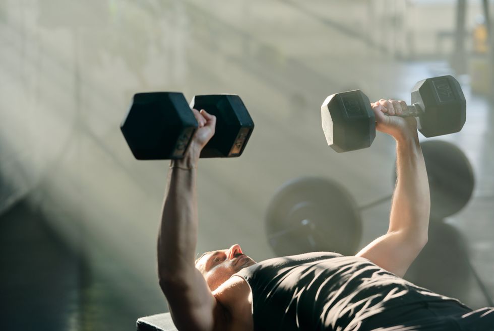 MAN LIFTING WEIGHTS