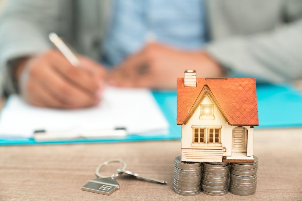 Man signing documents \u2013 buying a house concept