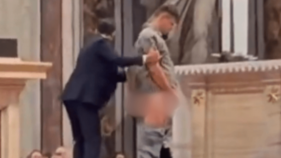 Man urinating at St Peter's Basilica