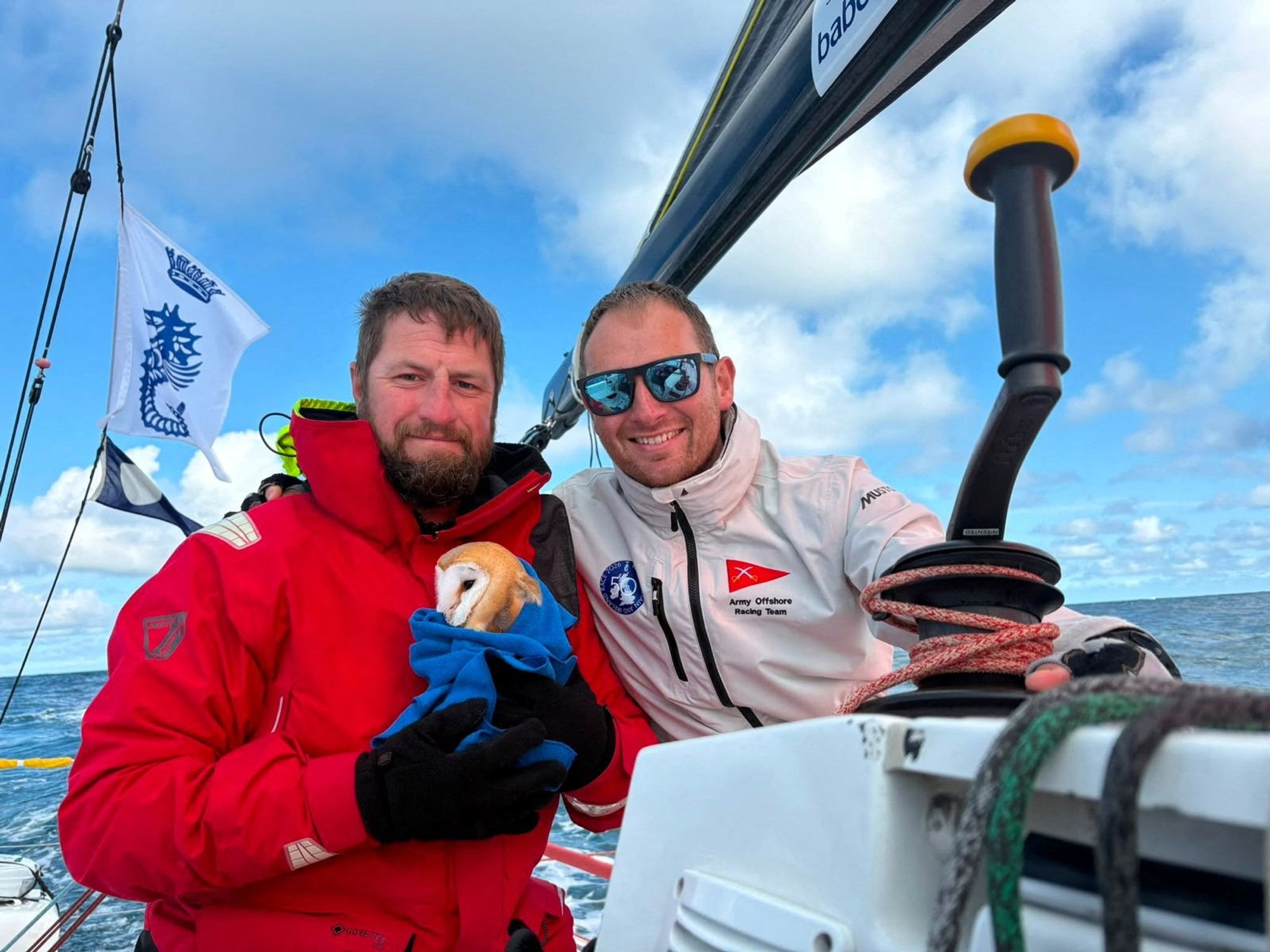 Mark Petherbridge (L) and Captain Tom Court (R) with rescued barn owl, Little Regina