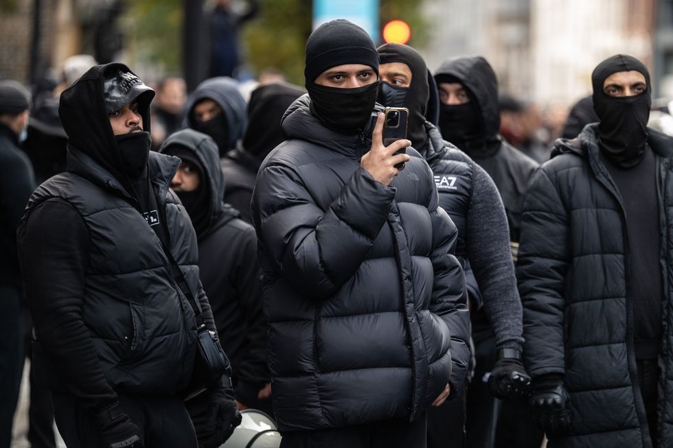 Masked men march through Whitechapel, Tower Hamlets