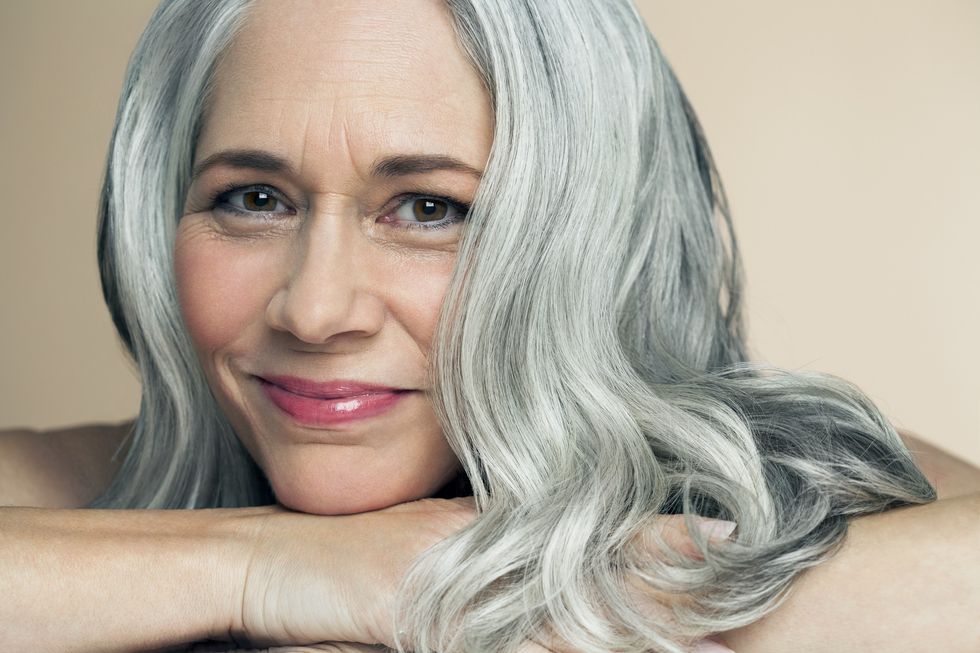Mature woman wearing lip gloss
