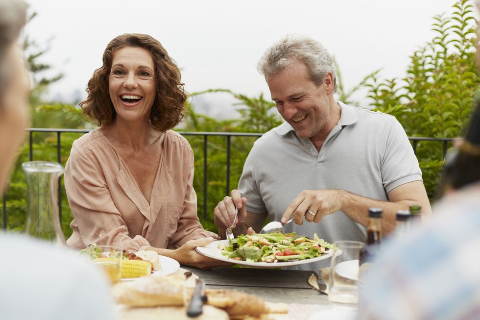 Middle-aged couple eating