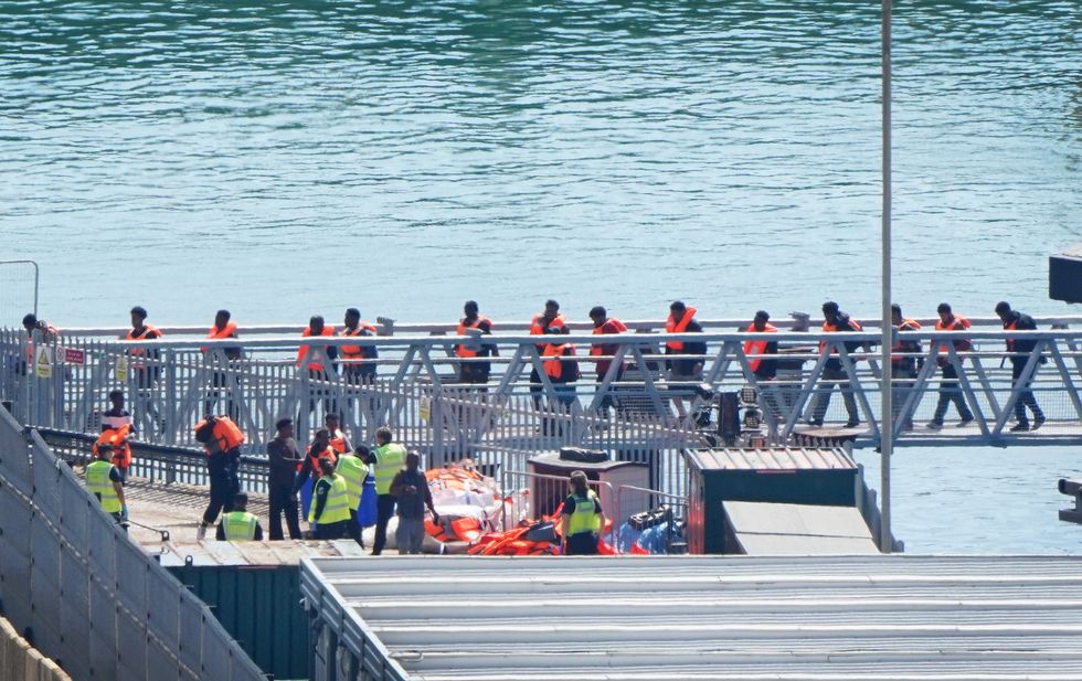 Migrant dinghy passengers arriving in Dover on Friday