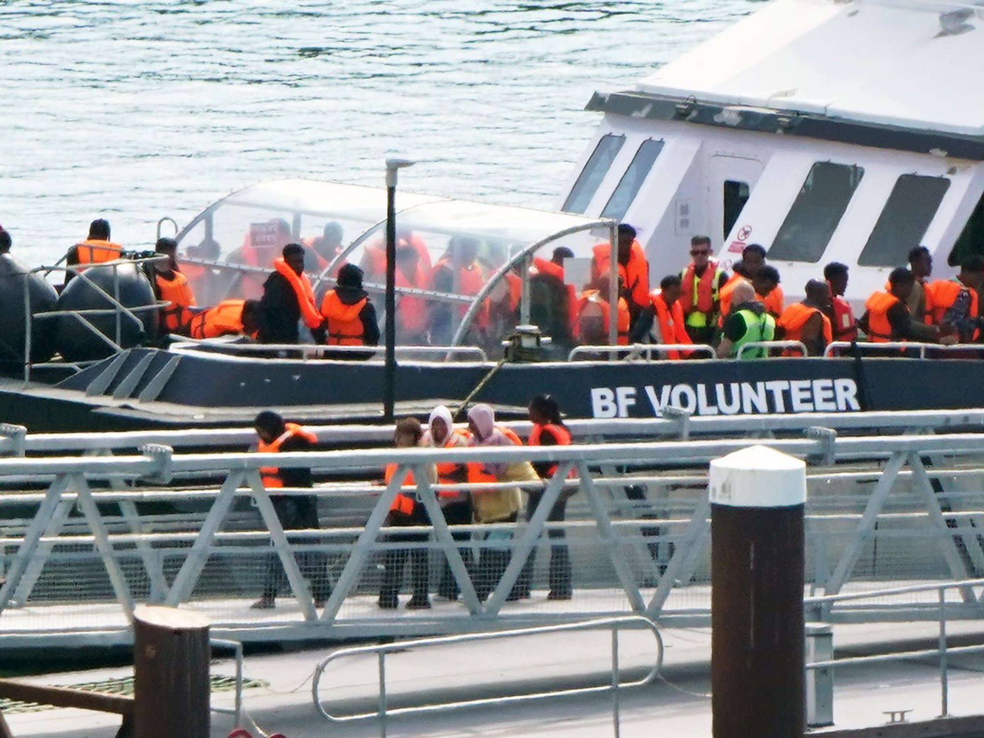 Migrant dinghy passengers arriving in Dover on Friday