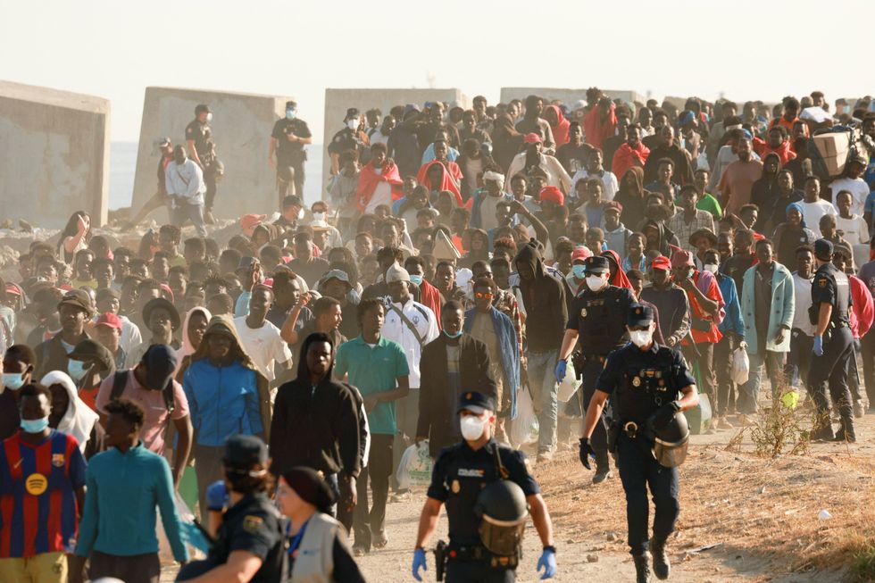 Migrants escorted