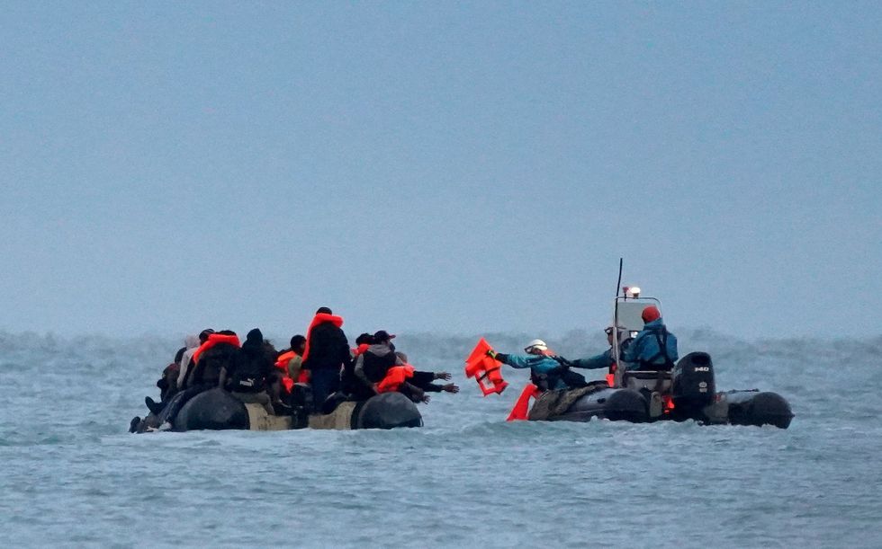 Migrants from France receiving life jackets