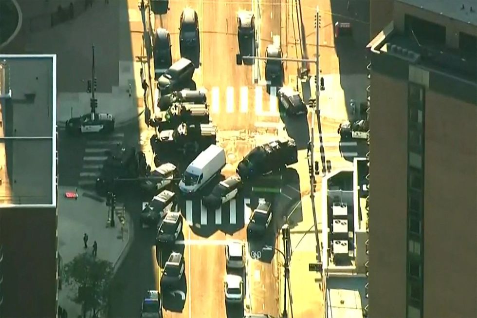 Minneapolis shooting scene: police cars form a vehicular cordon