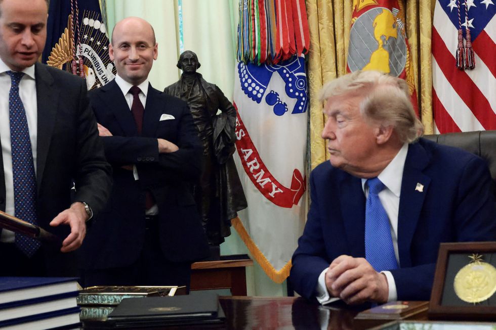 Mr Trump with White House Deputy Chief of Staff Stephen Miller and White House Staff Secretary Will Scharf today