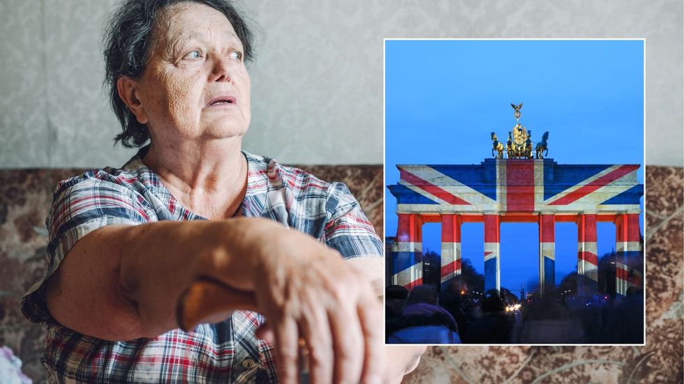 Older woman and Brandenburg Gate with Union Jack projected on it