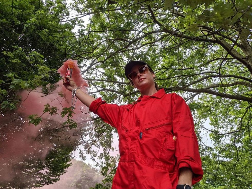 One of the protesters igniting a flare at the Bristol site\u200b