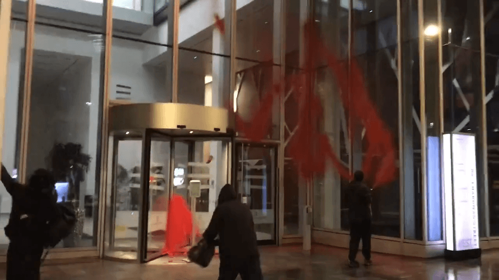 Palestine Action throw paint at building in Manchester