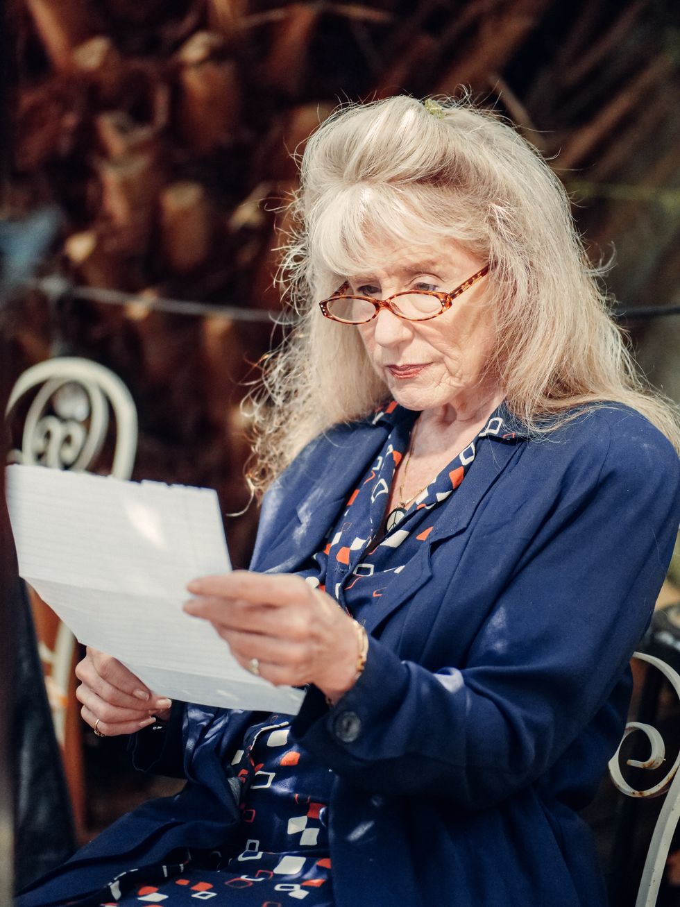 Pensioner looking at letter