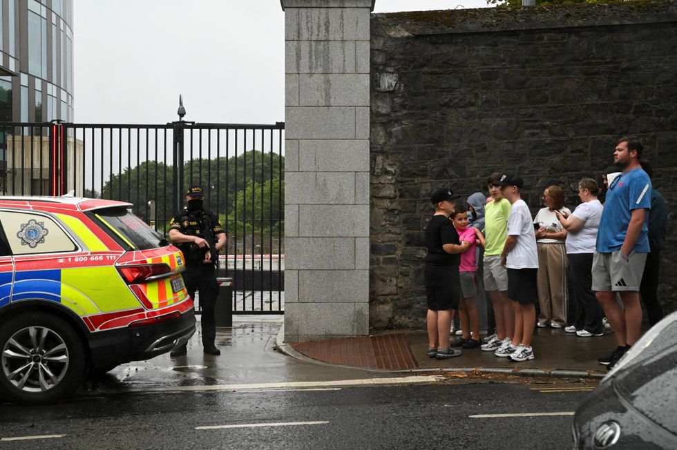 People gather outside the Special Criminal Court where alleged Irish crime gang boss Daniel Kinahan is due to appear