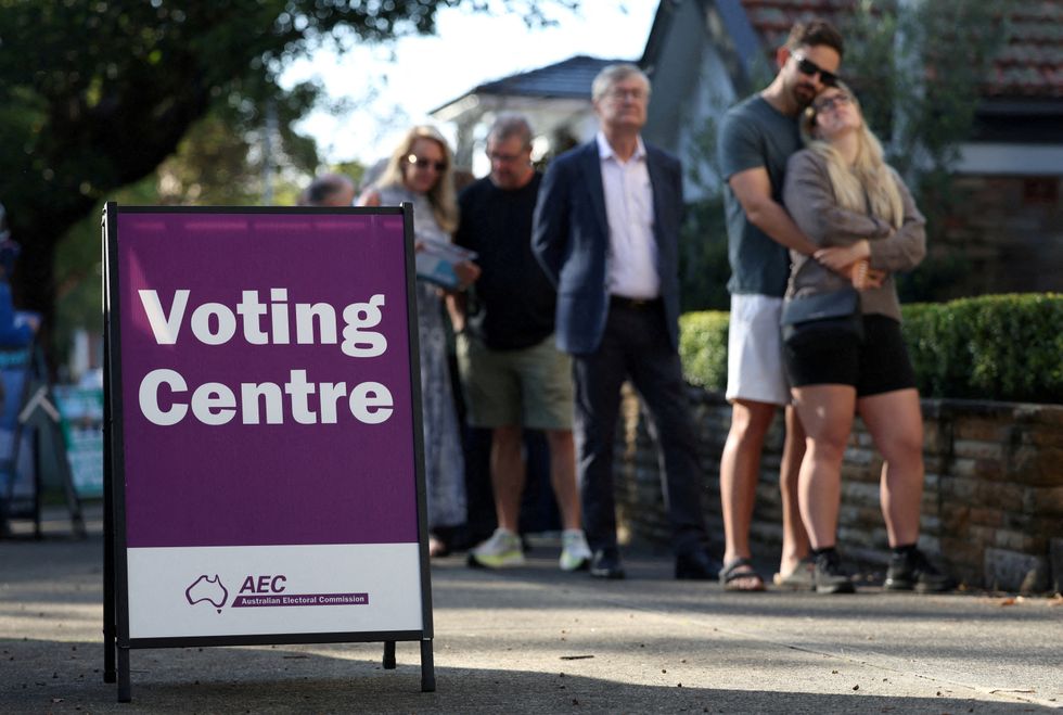 People queue to vote outside a pre-polling centre in Sydney, Australia