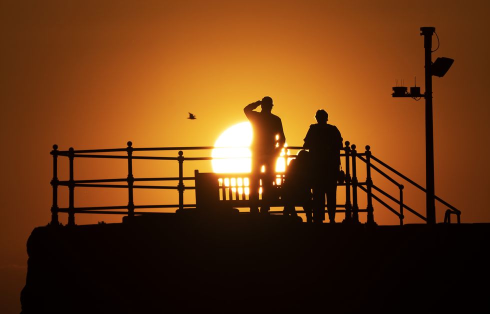 People watch the sunset