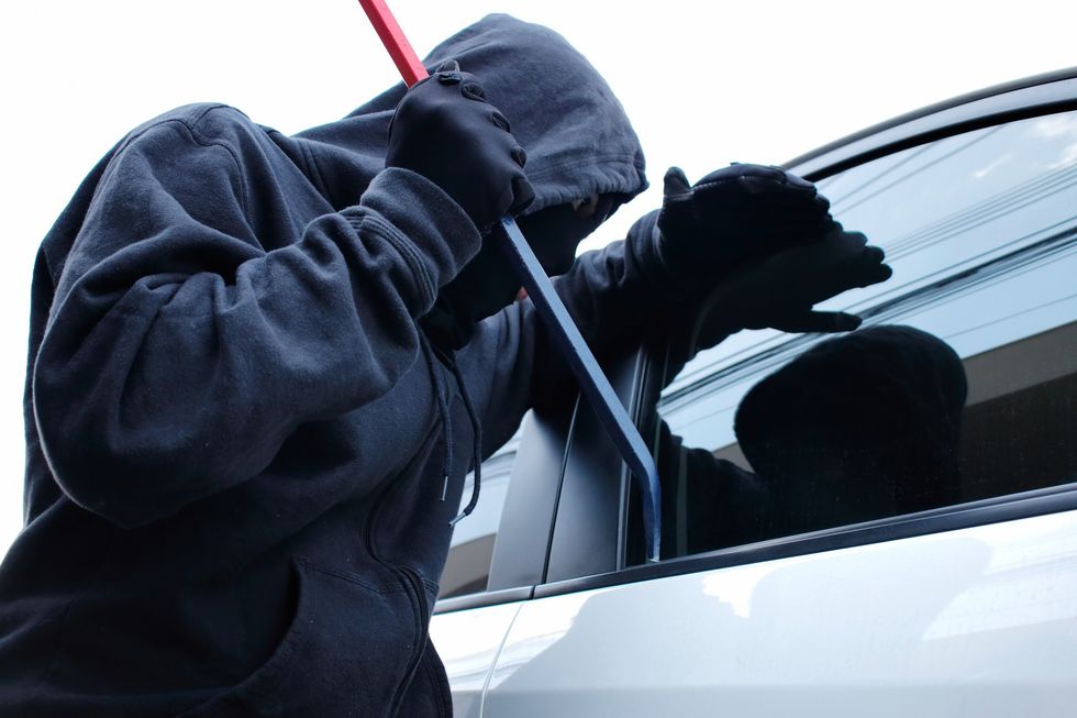 Person breaking into a car