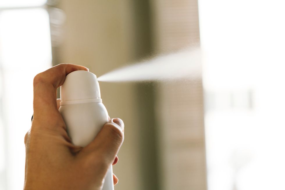 Person spraying spray