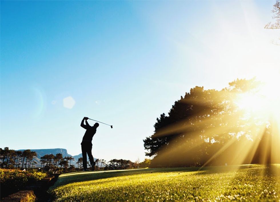 Person swinging on golf course
