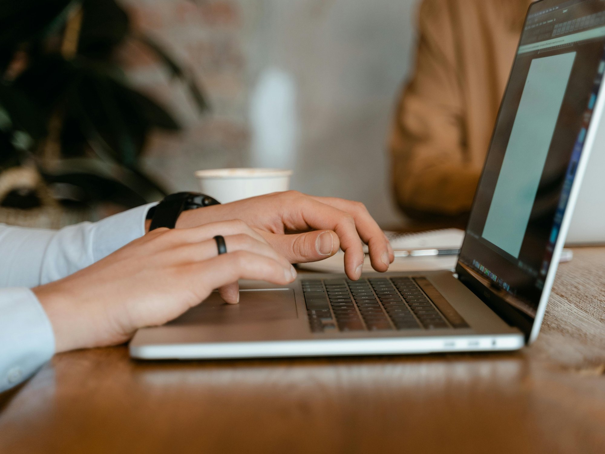 Person typing on a laptop