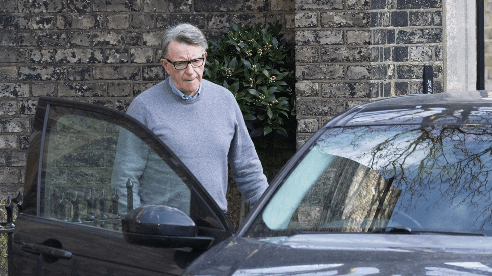 Peter Mandelson leaving his home