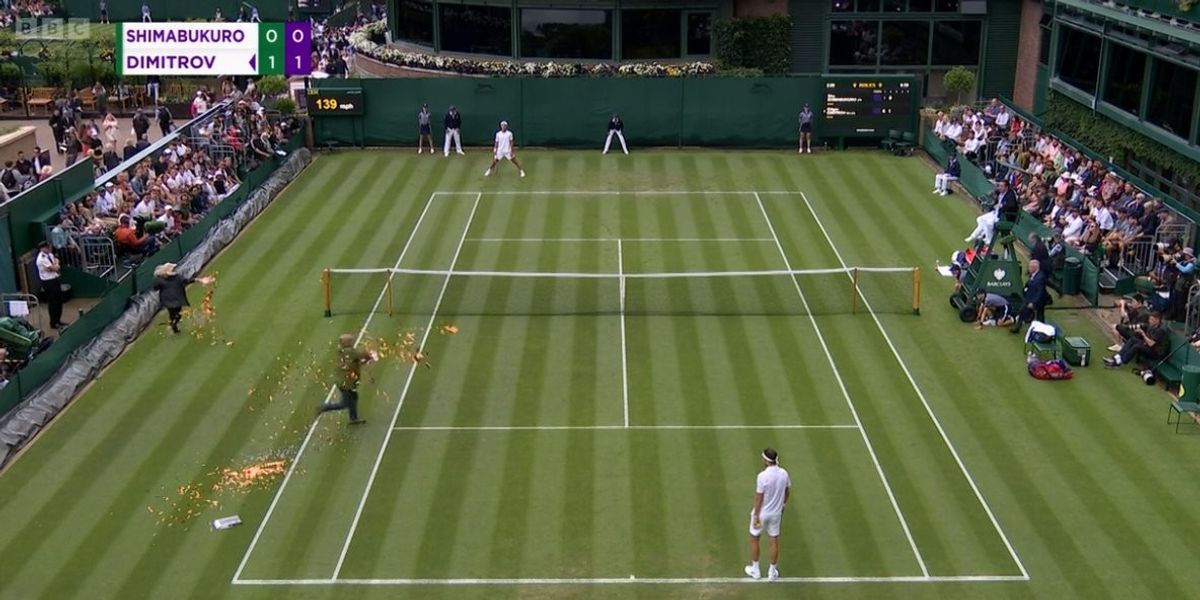 Just Stop Oil protesters storm court at Wimbledon as orange confetti thrown over grass