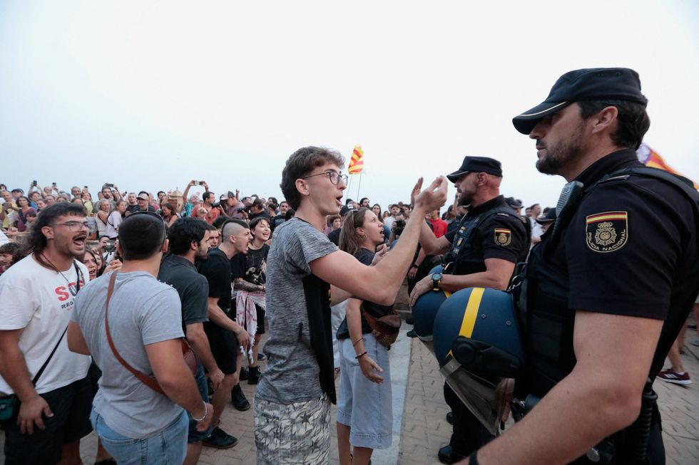 Police and protesters in Spain