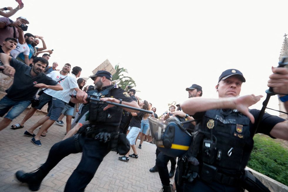 Police in Majorca swinging batons