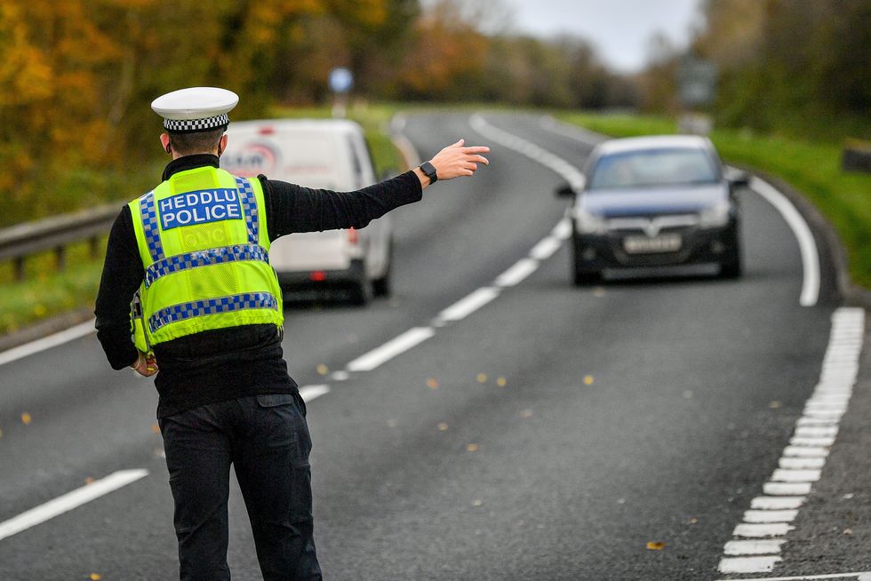 Police officer pulling a car over