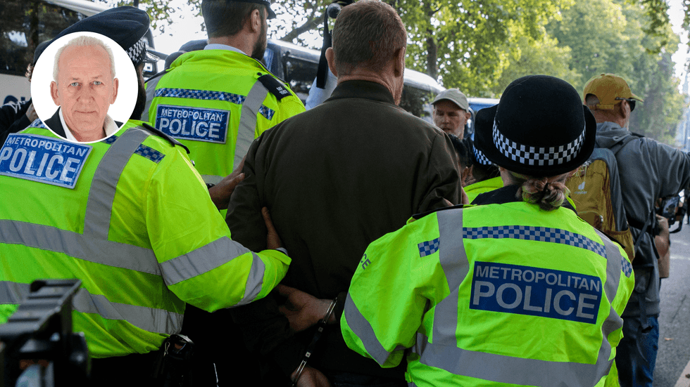 Police officers arrest someone