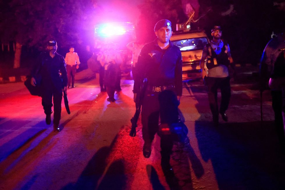 Police officers arrive to take their positions outside Shifa International Hospital after the Supreme Court ordered authorities to move jailed former Pakistani Prime Minister Imran Khan to the hospital