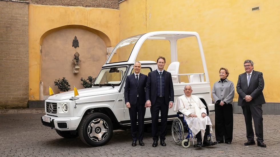 Pope Francis with the Mercedes-Benz Popemobile 