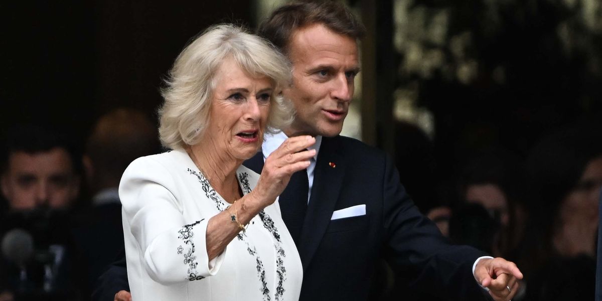 Emmanuel Macron spotted placing hand on Queen Camilla's back at British Museum