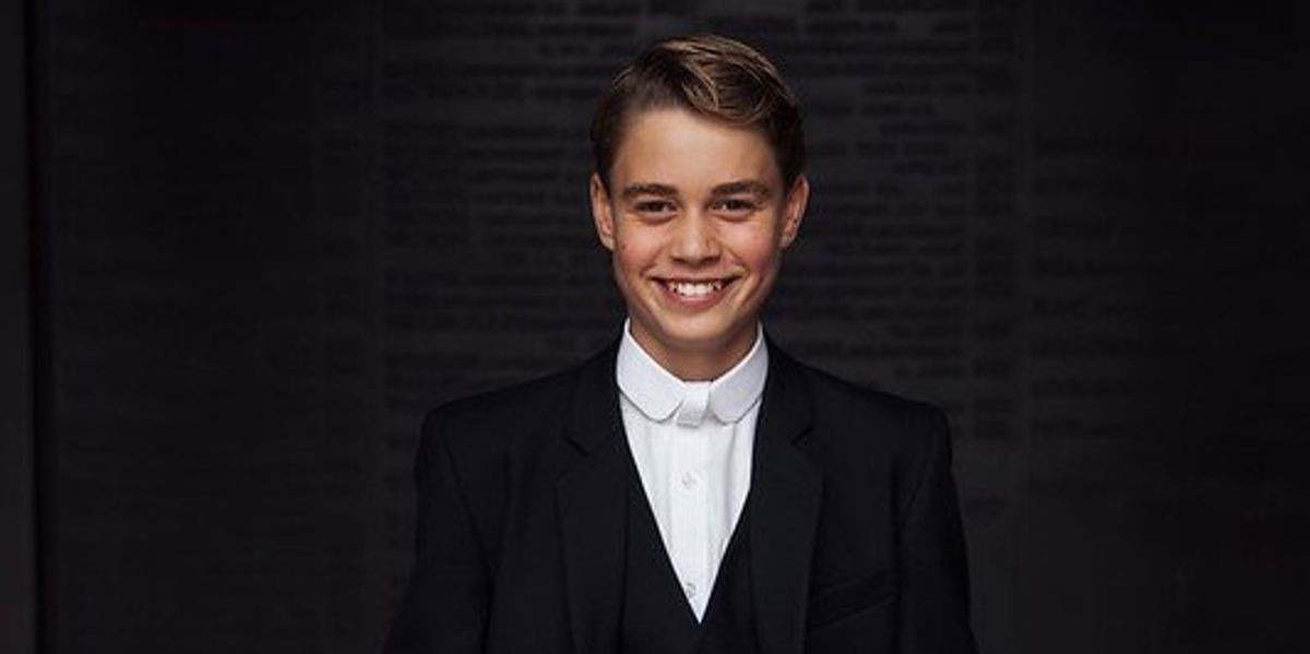 Prince George beams as he is pictured in Eton College's uniform for the first time