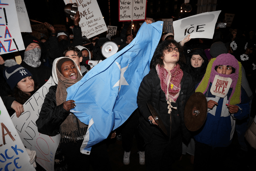 Protestor waving a Somali flag during the protests