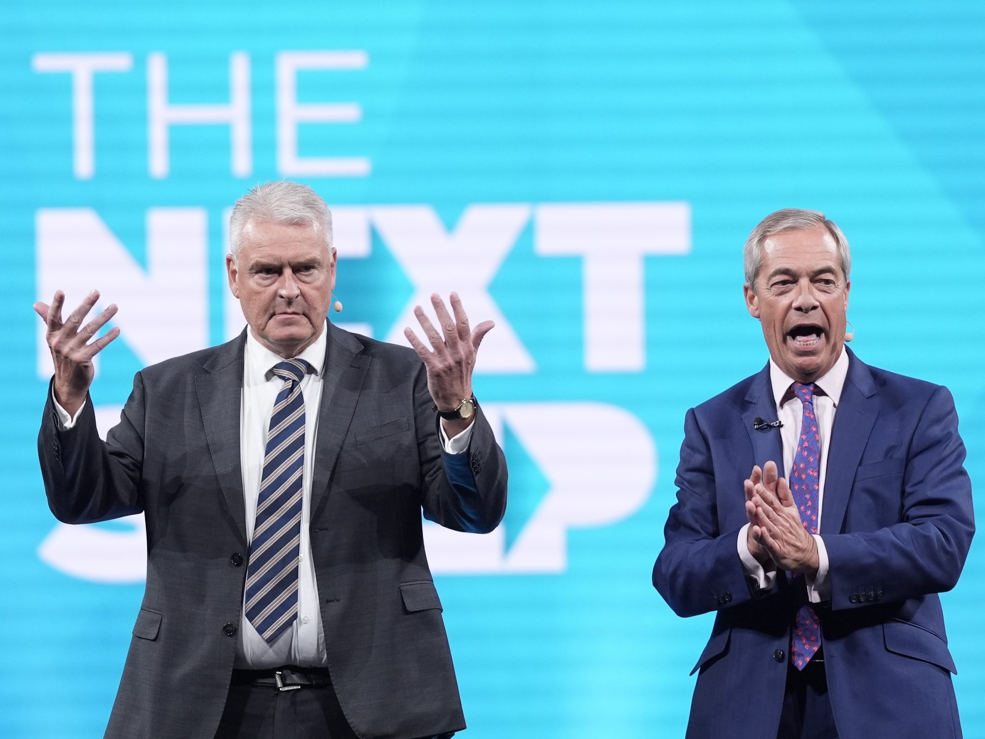 Reform UK MP for Ashfield, Lee Anderson (left) and Reform UK leader Nigel Farage on stage during the Reform UK party's annual conference at the National Exhibition Centre in Birmingham