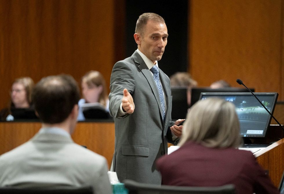 Ryan McBride, prosecuting, points at Tyler Robinson during closing arguments